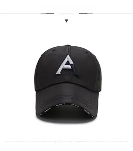 Close-up of black baseball cap featuring 3D embroidered A and sports logo on the brim