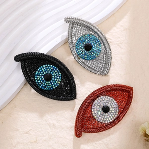 Exaggerated devil's eye brooches with crystal rhinestones in silver black and red