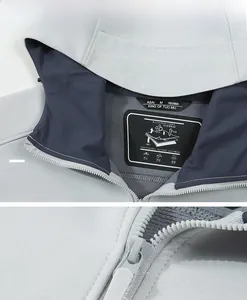 Macro detail of waterproof softshell jacket collar with functional label and zipper