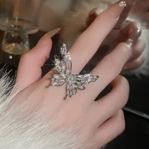 Zircon butterfly pearl open ring in silver finish worn on finger for fashion look