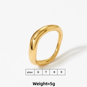 Macro view of gold minimalist irregular wave ring with polished stainless steel finish