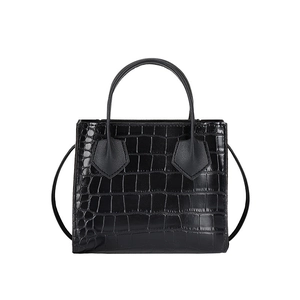 Classic black crocodile pattern tote bag with top handles and slender shoulder strap