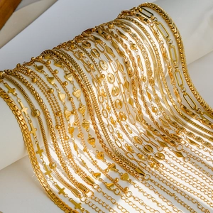 Detailed macro shot of 18K gold plated titanium steel chain collection with lobster clasps