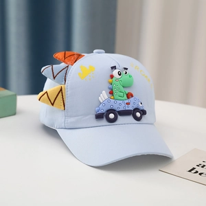 Detail of blue kids baseball cap with 3D cartoon dinosaur car and colorful spikes