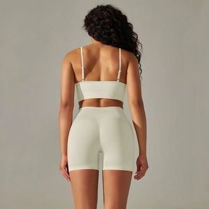 Detail of seamless ribbed sports set showing back criss-cross straps and lift design