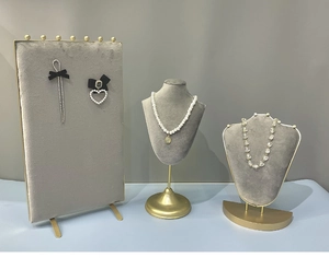 Gray velvet jewelry display stand set with golden metal base for necklaces and earrings