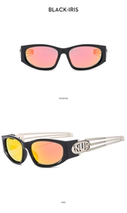 Detail view of Y2K futuristic sunglasses with orange mirrored lenses and NUK silver logo