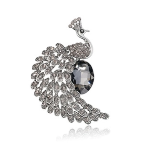 Exquisite peacock brooch with dark crystal body and shimmering rhinestone feathers detail