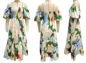 Close-up of the floral off-shoulder maxi dress with tiered skirt and smocked bodice detail
