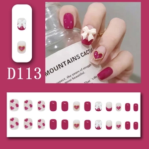 Sweet dark magenta press-on nails set with white 3D bows and ruby heart charms