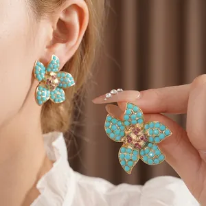 Vintage floral stud earrings with sky blue stones and pink zircon in gold setting