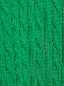 Close-up detail of green cable-knit texture and soft fabric on V-neck sweater
