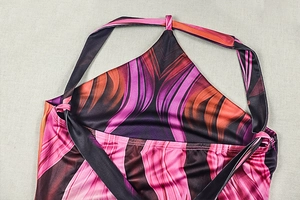 Detail of colorful halter neck tie on dress with silk-like wave pattern print