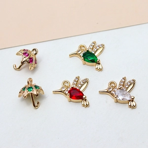 Gold-plated DIY charms with umbrella and hummingbird shapes inlaid with colorful zircon