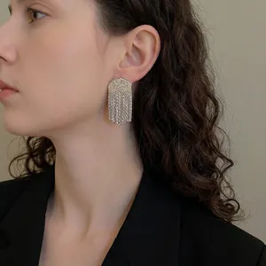 Exaggerated geometric fringe earrings in silver finish with hammered metal texture