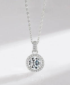 Macro detail of S925 sterling silver halo pendant necklace with sparkling cubic zirconia