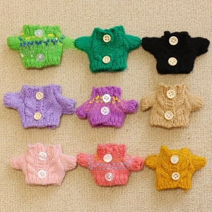 Set of 9 colorful mini knitted doll sweaters with white buttons and cable knit textures