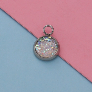 Macro shot of 12mm stainless steel pendant tray with colorful starry glitter inlay