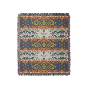 Rectangular ethnic geometric woven picnic blanket with colorful tassels on a white background