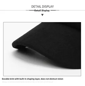 Close-up of the sturdy curved brim and structured fabric detail on the winter cap