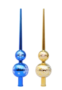 Detail of blue and gold Christmas tree topper with snowflake patterns and glitter finish