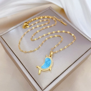 Luxurious gold titanium necklace with blue dolphin pendant in a jewelry gift box