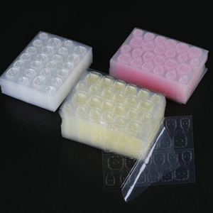 Strong adhesive nail glue tabs in yellow pink and clear colors for long lasting manicures
