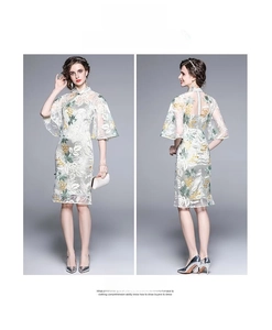 Detail of vintage style lace cheongsam dress with floral embroidery and bell sleeves