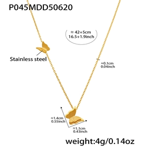 Detail view of gold butterfly pendant with frosted finish and stainless steel O-chain