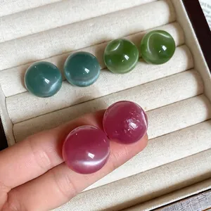 Polished round cat eye stone stud earrings in pink, cyan and green pastel colors