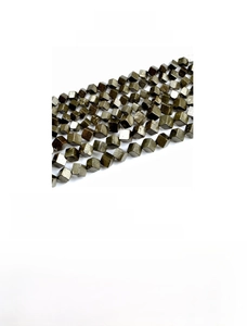 Macro shot of 6-8mm diagonal cube natural pyrite beads for jewelry making