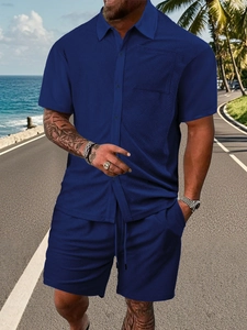 Detailed close-up of dark blue short sleeve waffle texture shirt and shorts set for men