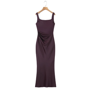 Detail of deep purple satin evening dress featuring elegant side pleats and fishtail hem