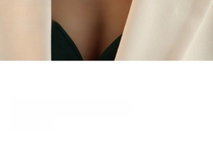 Detail of light beige v-neck blazer featuring premium fabric and elegant tailored fit