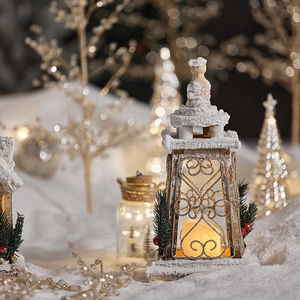 Rustic wooden Christmas house lantern with warm LED lights and artificial snow coating