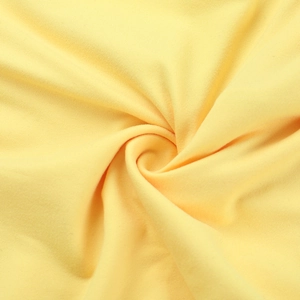 Macro view of bright yellow knit fabric texture showing soft and dense material detail