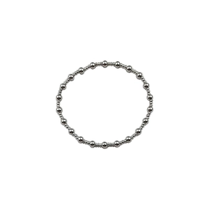 Detail of silver beaded necklace with polished spherical beads on white background