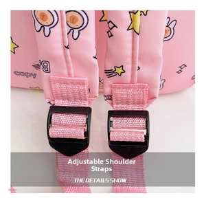 Detail of adjustable pink woven shoulder strap with black buckle on cartoon backpack