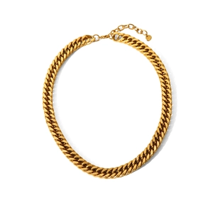 Detail of golden stainless steel Cuban link chain with lobster clasp and extender