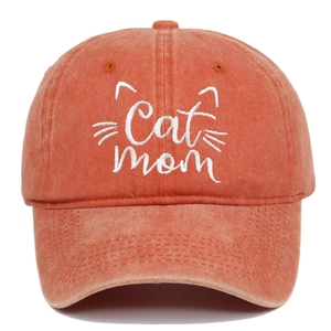 Close-up of Cat Mom embroidery on orange washed cotton vintage baseball cap