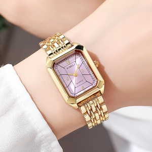 Detail shot of rectangular gold steel watch with a sunray lavender dial on wrist