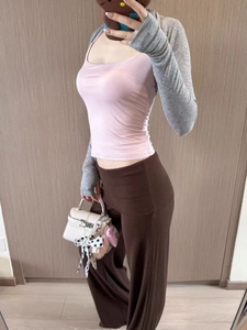 Detailed mirror selfie of a pink U-neck vest with gray arm sleeves and brown wide-leg pants