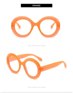 Detailed front and side views of oversized orange round frames with gold metal accents