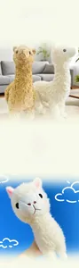 Detail of plush alpaca toys with curly fur and cute faces in white and brown colors