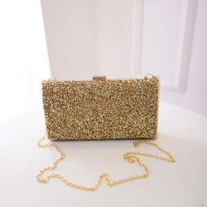 Elegant gold sparkly evening clutch bag with metal frame and detachable chain strap