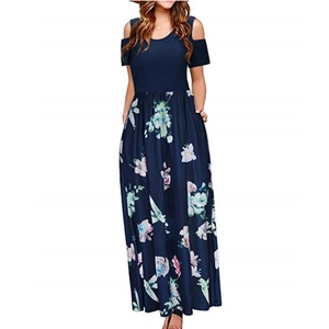 Detail of cold shoulder design and large floral print on dark blue summer maxi dress