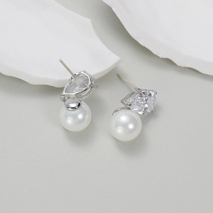 Elegant teardrop AAA cubic zirconia and white round pearl stud earrings in silver finish