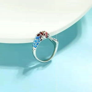 Close-up of koi fish enamel ring with blue and red gradient lotus petals detailing