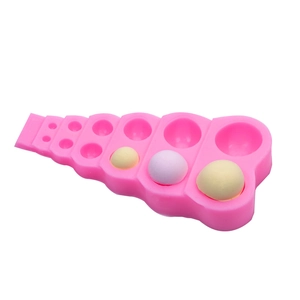 Molde de silicona rosa con medias esferas de varios tamaños para fondant y dulces