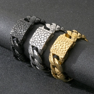 Macro view of 25mm Cuban links with pebble texture in black, silver, and gold steel